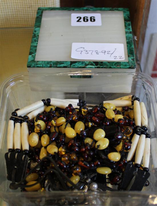 Onyx cigarette box, amber beads etc(-)